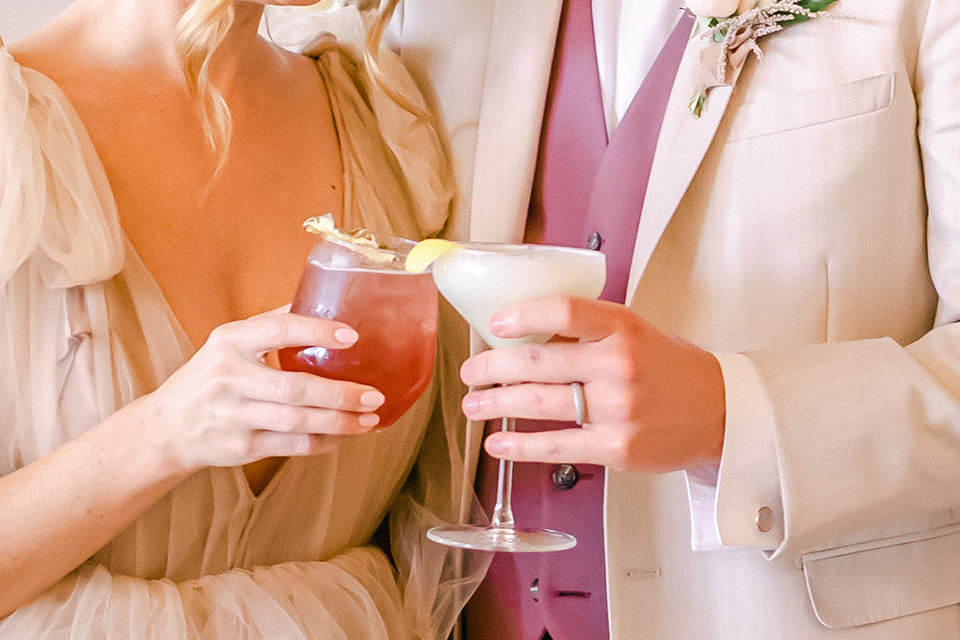  fun pink and champagne wedding with the bride in a pink tulle gown and the groom n a tan and pink look- cocktails