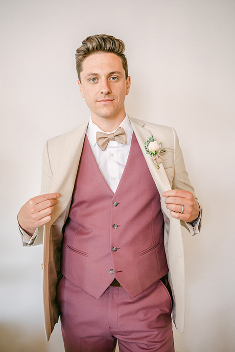  fun pink and champagne wedding with the bride in a pink tulle gown and the groom n a tan and pink look- groom 