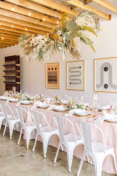  fun pink and champagne wedding with the bride in a pink tulle gown and the groom n a tan and pink look- tables and decor 