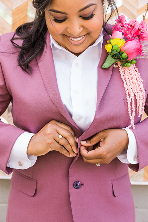  bright and bold lesbian wedding in Palm Springs with one bride in a rose pink suit and the other in a white suit – rose pink suit
