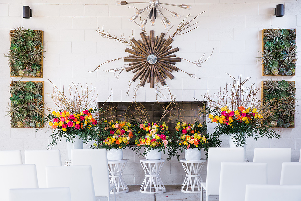  bright and bold lesbian wedding in Palm Springs with one bride in a rose pink suit and the other in a white suit – ceremony space