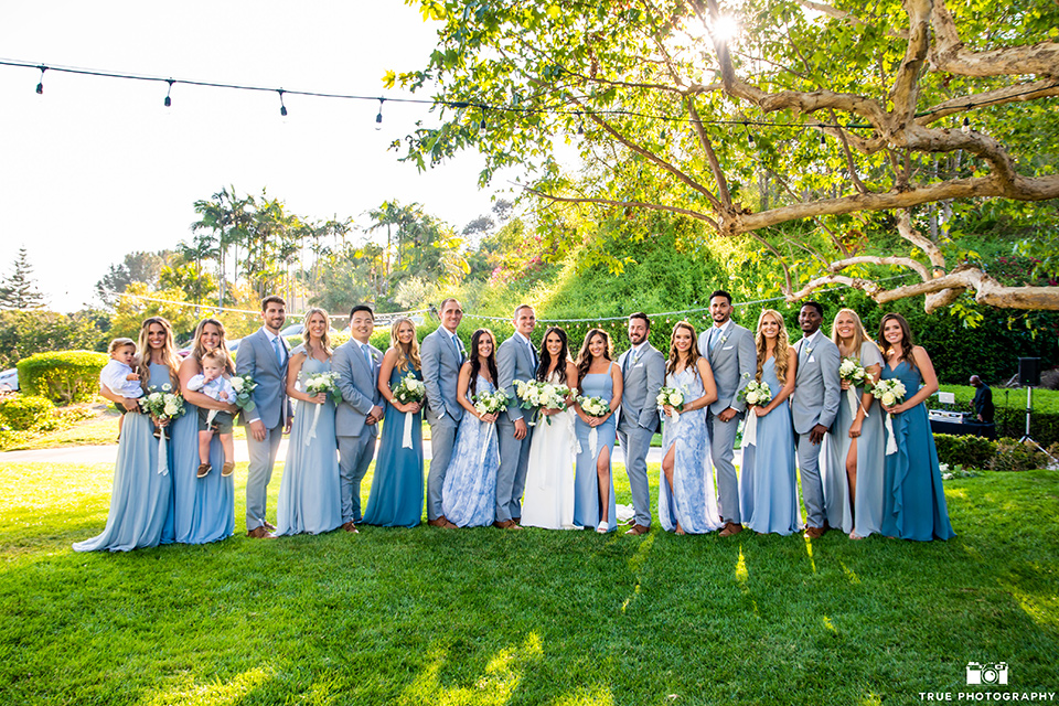  something blue inspired wedding with the bridesmaids in blue dresses the groomsmen in light blue suits and the bride in a lace gown – bridal party