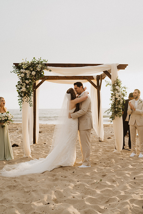  boho modern beach wedding on the sand – couple at ceremony