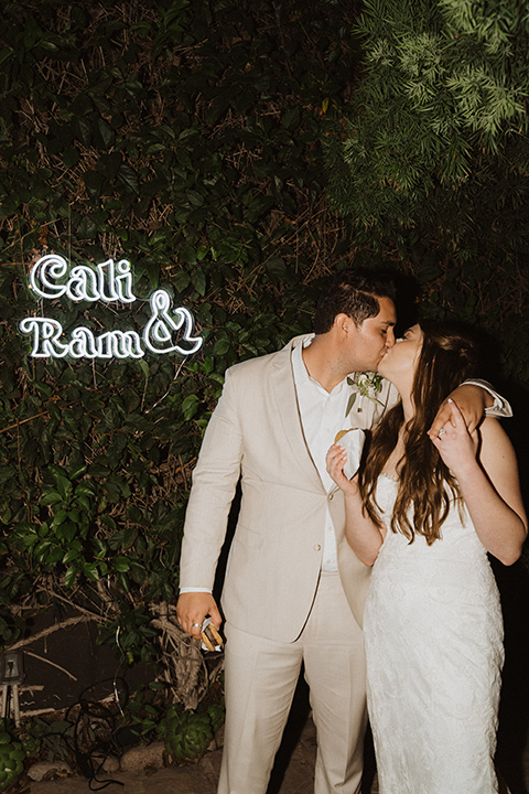  boho modern beach wedding on the sand – couple at reception