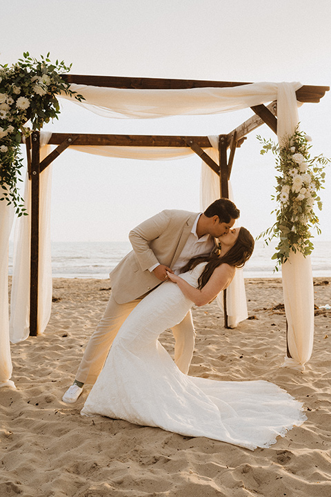  boho modern beach wedding on the sand – couple at ceremony