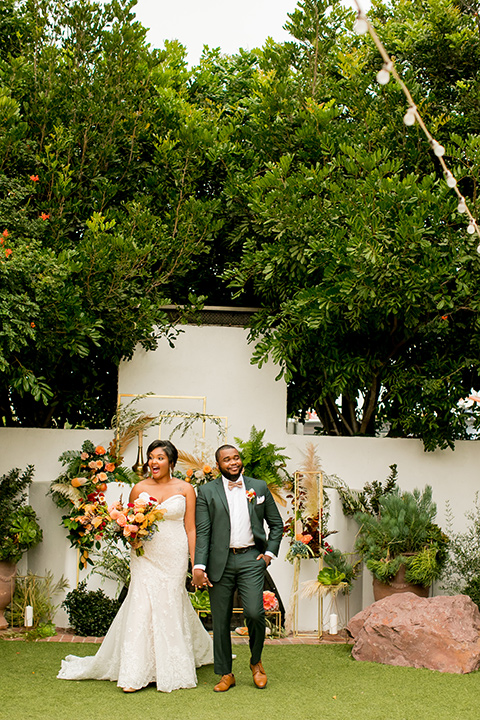  green and yellow casino san clemente wedding with the groom in a green suit - ceremony
