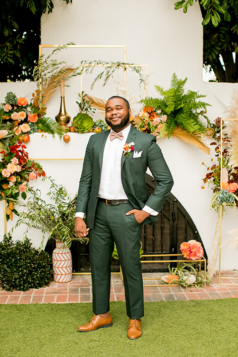  green and yellow casino san clemente wedding with the groom in a green suit - groom