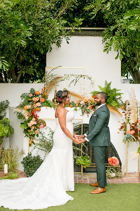  green and yellow casino san clemente wedding with the groom in a green suit - ceremony 