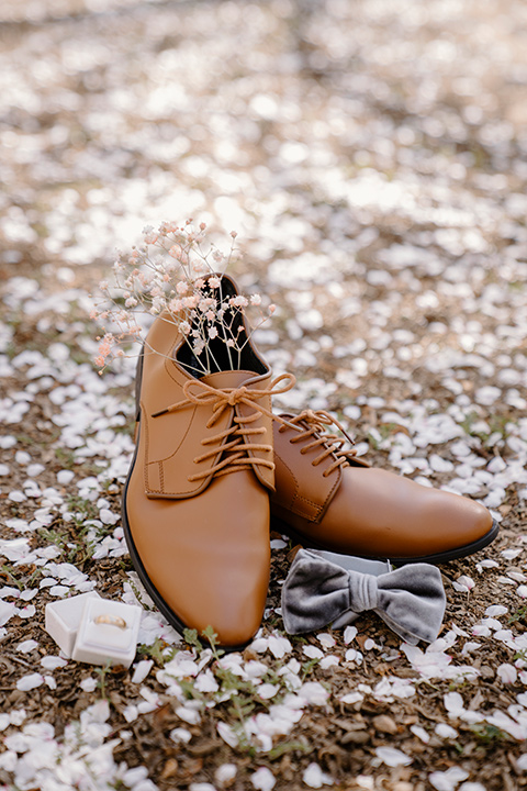  celestial cherry blossom wedding with the groom in a light blue coat and grey pants – groom shoes 