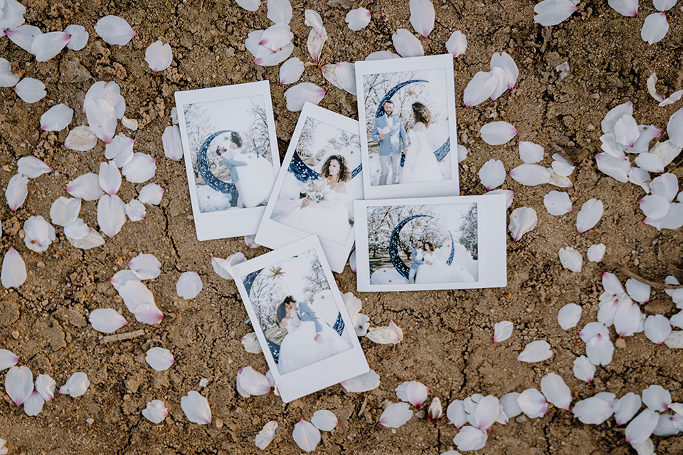  celestial cherry blossom wedding with the groom in a light blue coat and grey pants –polaroids