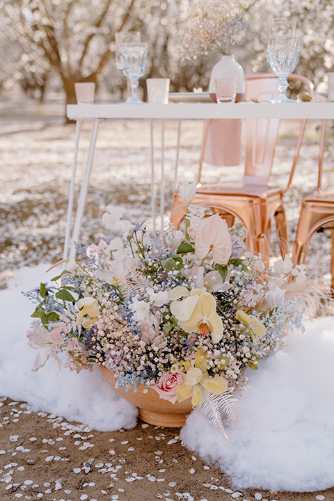  celestial cherry blossom wedding with the groom in a light blue coat and grey pants – tabletop decor