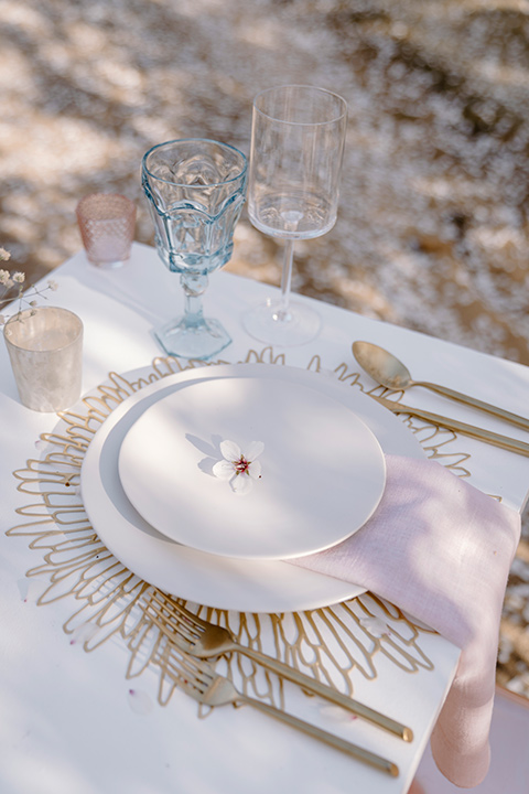  celestial cherry blossom wedding with the groom in a light blue coat and grey pants – table decor 