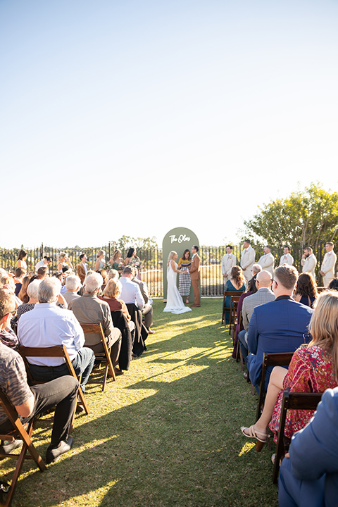  a groovy barn wedding with a neutral color palette and beer - ceremony 
