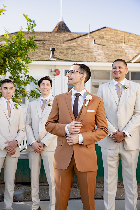  a groovy barn wedding with a neutral color palette and beer - groomsmen 