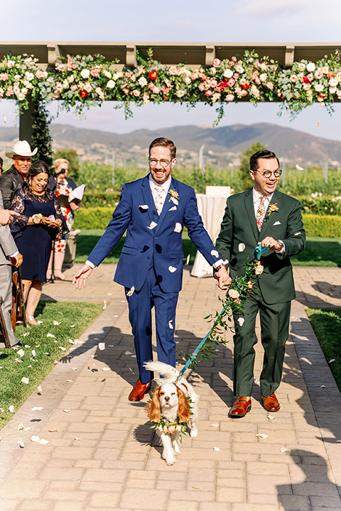  a dreamy garden wedding full of color and disco balls - couple walking down the aisle 