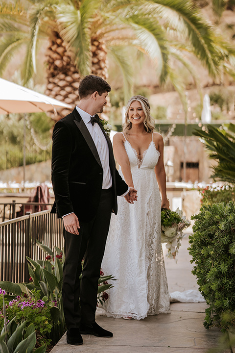  pink and black ranch wedding with elegant details - bridal part couple entering the reception y 