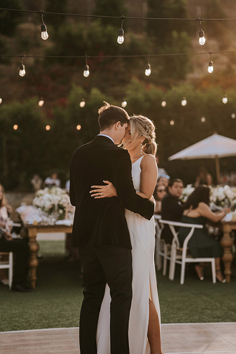  pink and black ranch wedding with elegant details - couple entering the reception 