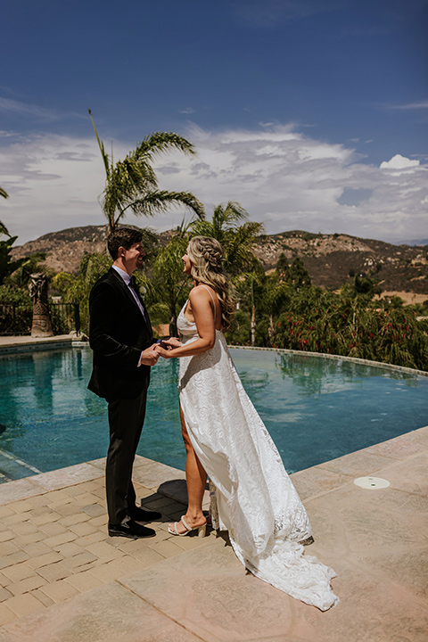  pink and black ranch wedding with elegant details - couple by the pool 