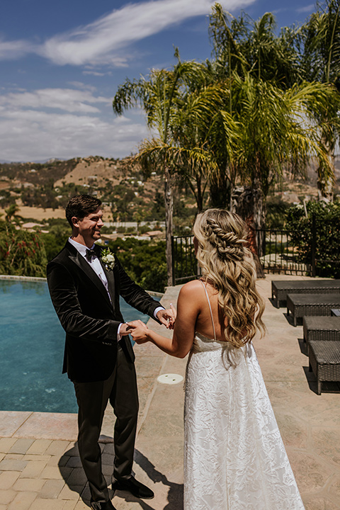  pink and black ranch wedding with elegant details - couple by the pool 