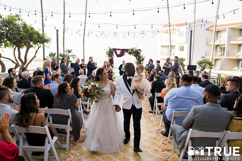  black and white beach wedding with lux details – walking down the aisle 