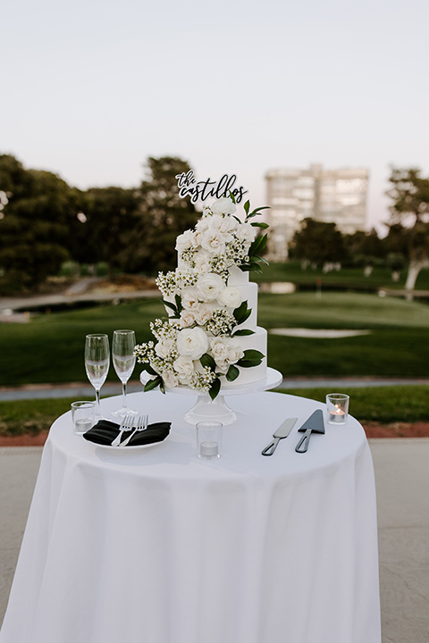  christine and gabes stunning black and white wedding with tropical touches – white tired cake with white flowers 