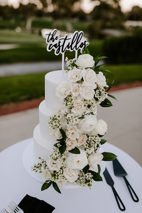 christine and gabes stunning black and white wedding with tropical touches – white tired cake with white flowers 