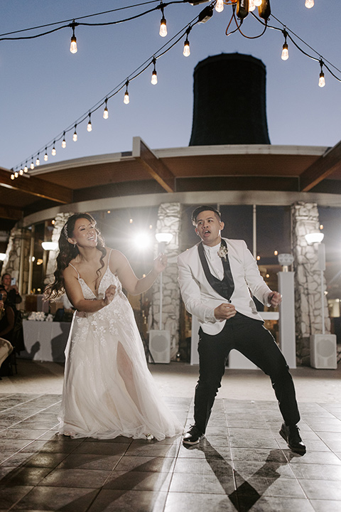 christine and gabes stunning black and white wedding with tropical touches – couple dancing at the reception 