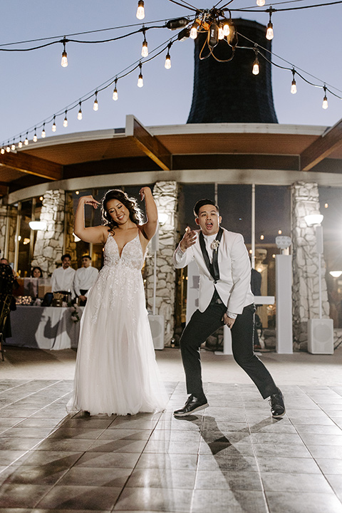  christine and gabes stunning black and white wedding with tropical touches – couple dancing at the reception 