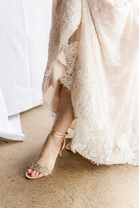  whimsical wedding at an ocean front venue with the groom in a mix and match look with navy and grey colors – bride