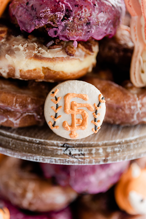  whimsical wedding at an ocean front venue with the groom in a mix and match look with navy and grey colors – cookies