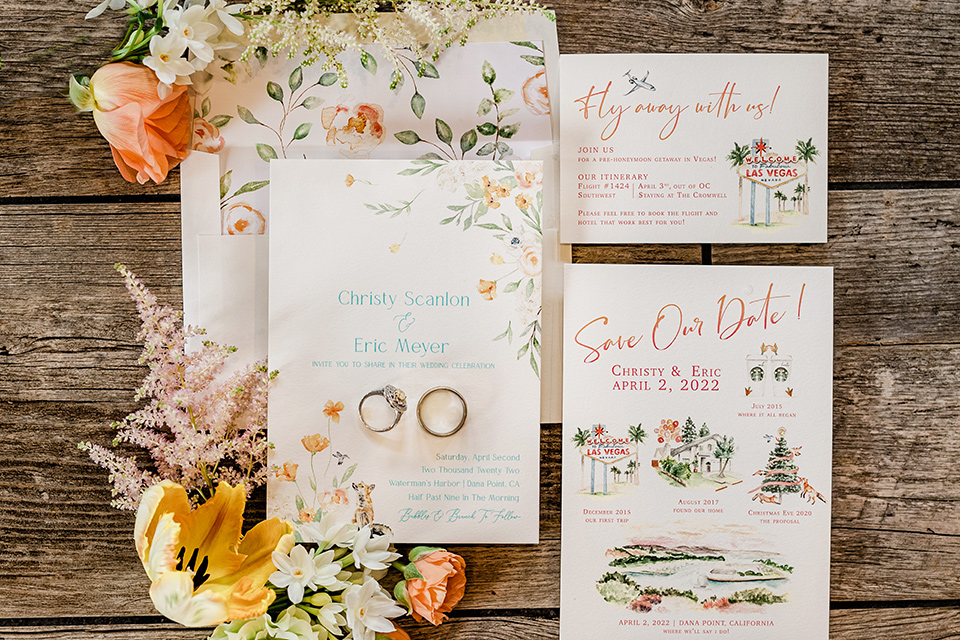  whimsical wedding at an ocean front venue with the groom in a mix and match look with navy and grey colors – invitations