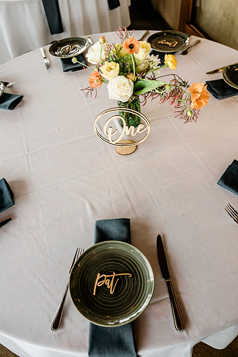  whimsical wedding at an ocean front venue with the groom in a mix and match look with navy and grey colors – table flatware 
