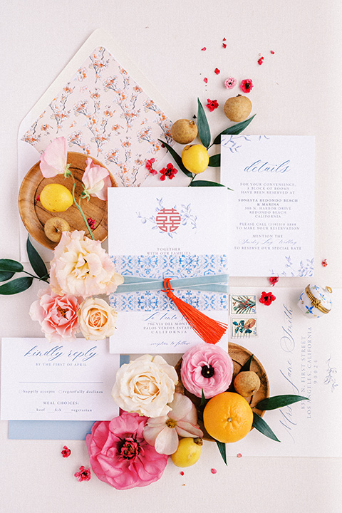  a Chinese-Spanish fusion wedding with the bride in a white flowing gown and the groom in a grey suit and burgundy velvet coat - invitations + fortune cookies 