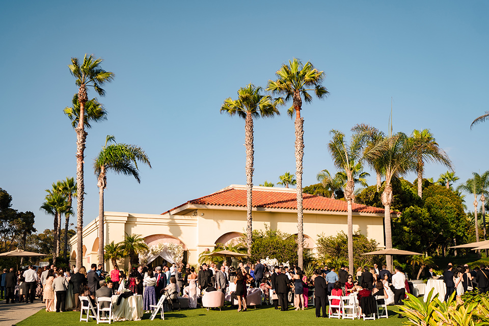  glitz and glam wedding by the beach with the bride in a lace crystal gown and the groom in a black tuxedo – ceremony space