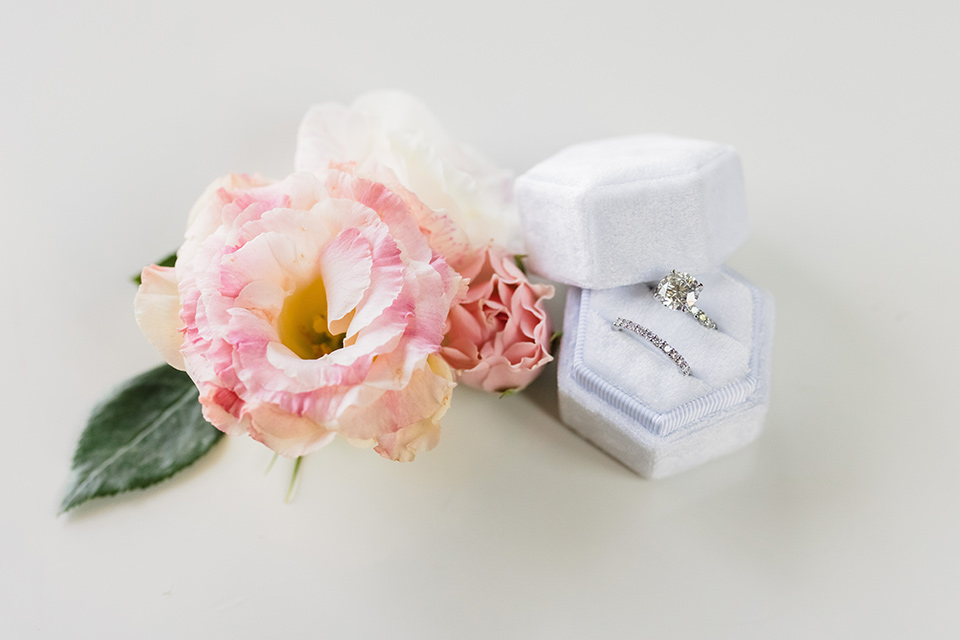  glitz and glam wedding by the beach with the bride in a lace crystal gown and the groom in a black tuxedo – rings