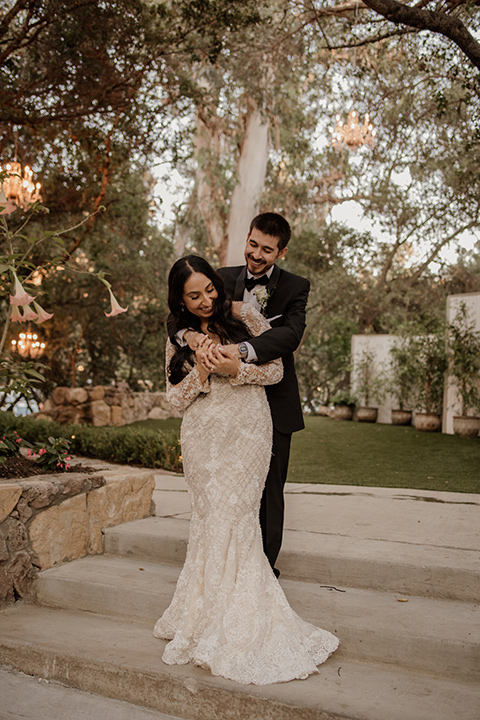  black and blush wedding with drums and star décor – couple hugging