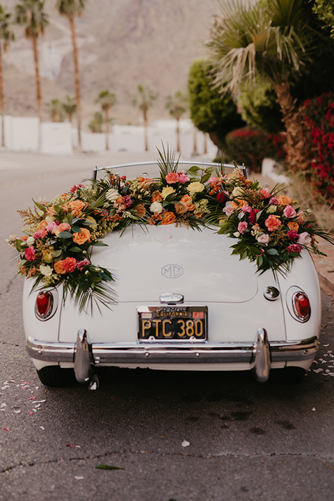  a funky groovy downtown palm springs wedding with bright colors and boho style - vintage car 