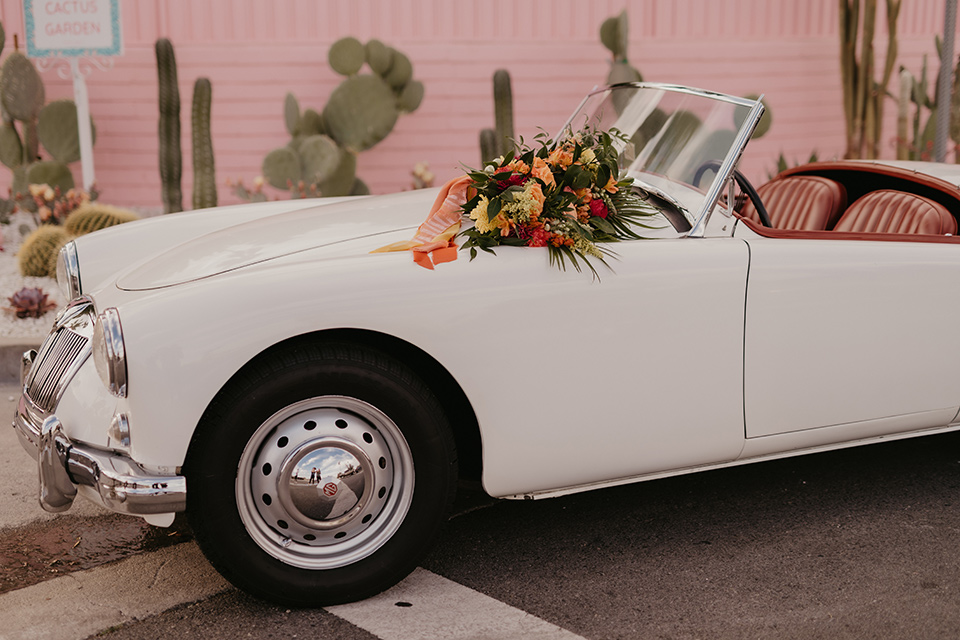  a funky groovy downtown palm springs wedding with bright colors and boho style - car 