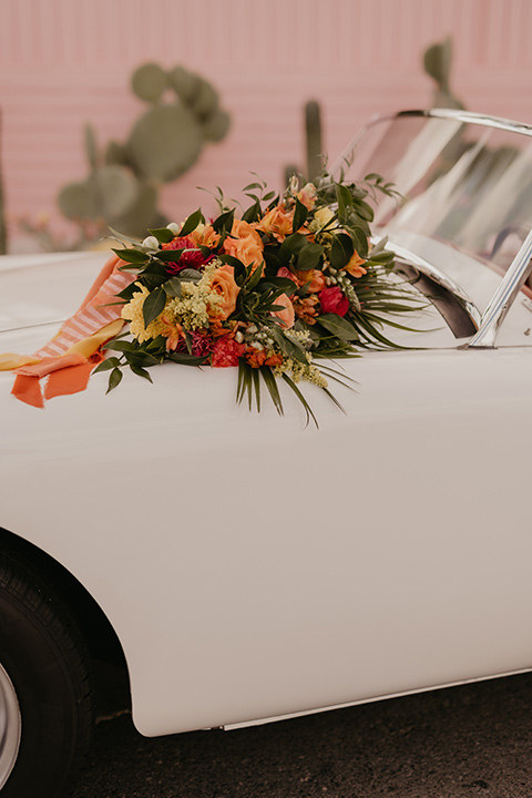  a funky groovy downtown palm springs wedding with bright colors and boho style - vintage car 