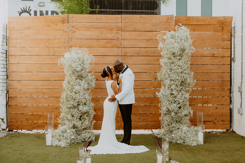 white and black wedding at the East Angel in LA –first kiss