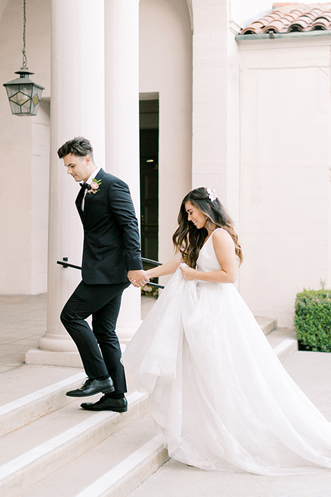 black and white classic wedding at the ebell in LA – couple walking