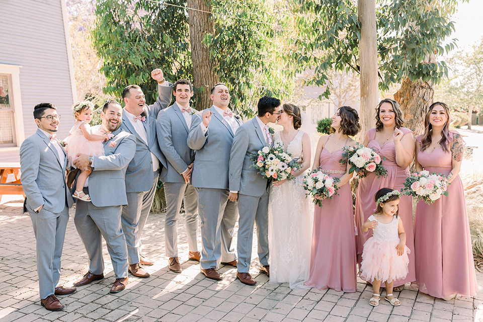  a romantic garden wedding with grey and pink décor and style, with the bride in a gorgeous white gown and the groom in a heather grey suit, the bridesmaids were in blush pink gowns and the groomsmen in heather grey suits – group photo