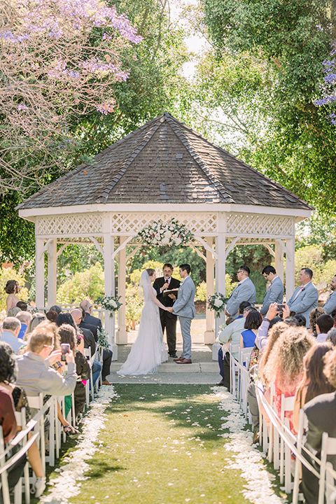  a romantic garden wedding with grey and pink décor and style, with the bride in a gorgeous white gown and the groom in a heather grey suit, the bridesmaids were in blush pink gowns and the groomsmen in heather grey suits – ceremony