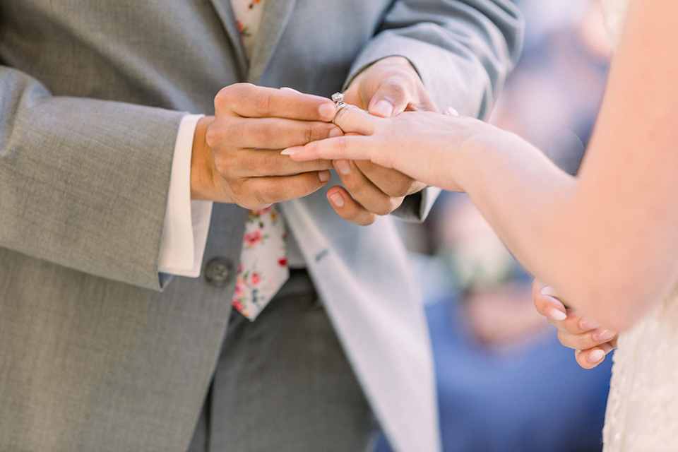  a romantic garden wedding with grey and pink décor and style, with the bride in a gorgeous white gown and the groom in a heather grey suit, the bridesmaids were in blush pink gowns and the groomsmen in heather grey suits – exchanging rings