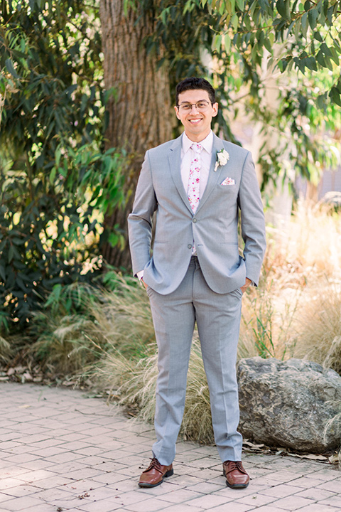  a romantic garden wedding with grey and pink décor and style, with the bride in a gorgeous white gown and the groom in a heather grey suit, the bridesmaids were in blush pink gowns and the groomsmen in heather grey suits - groom