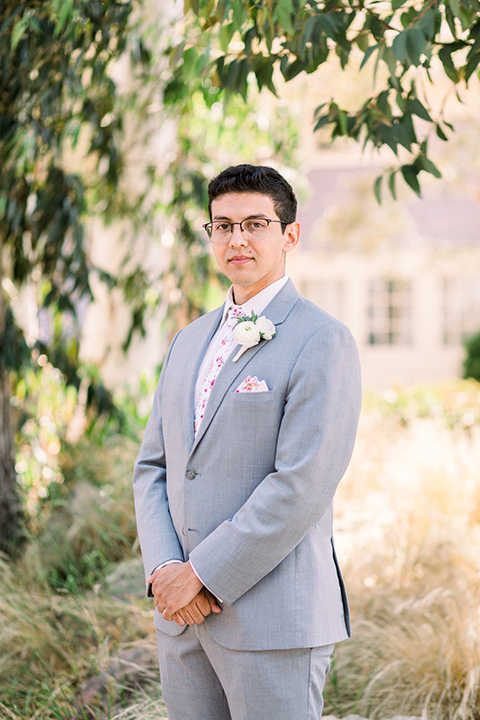  a romantic garden wedding with grey and pink décor and style, with the bride in a gorgeous white gown and the groom in a heather grey suit, the bridesmaids were in blush pink gowns and the groomsmen in heather grey suits – groom