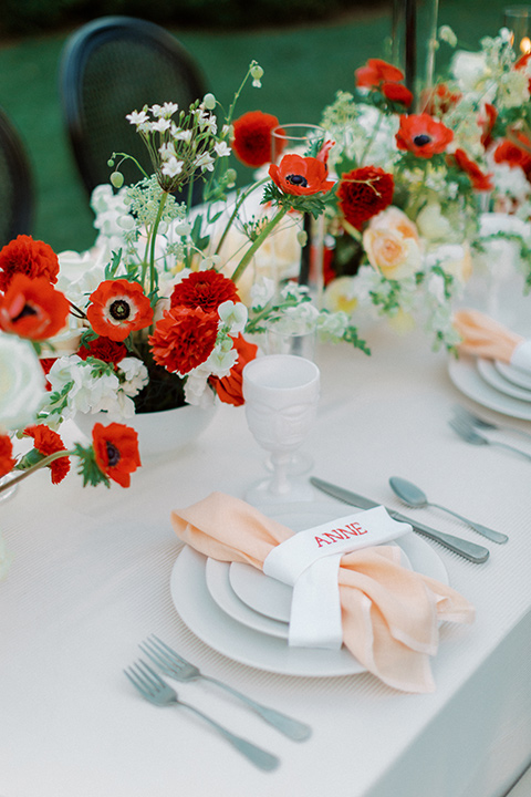  modern white and black wedding with pops of red – reception table and décor 