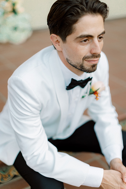  modern white and black wedding with pops of red – groom 