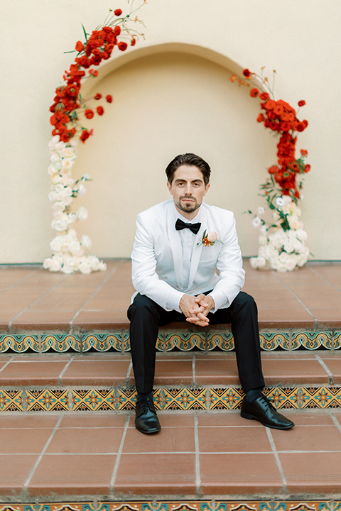  modern white and black wedding with pops of red – groom 