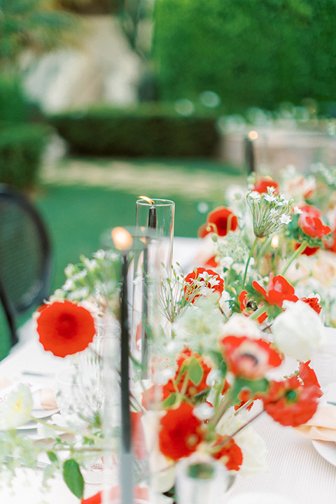  modern white and black wedding with pops of red – cake and flowers 